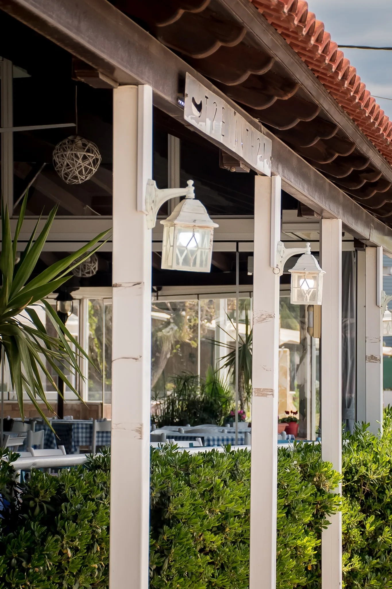 The covered walkway along the front of the taverna