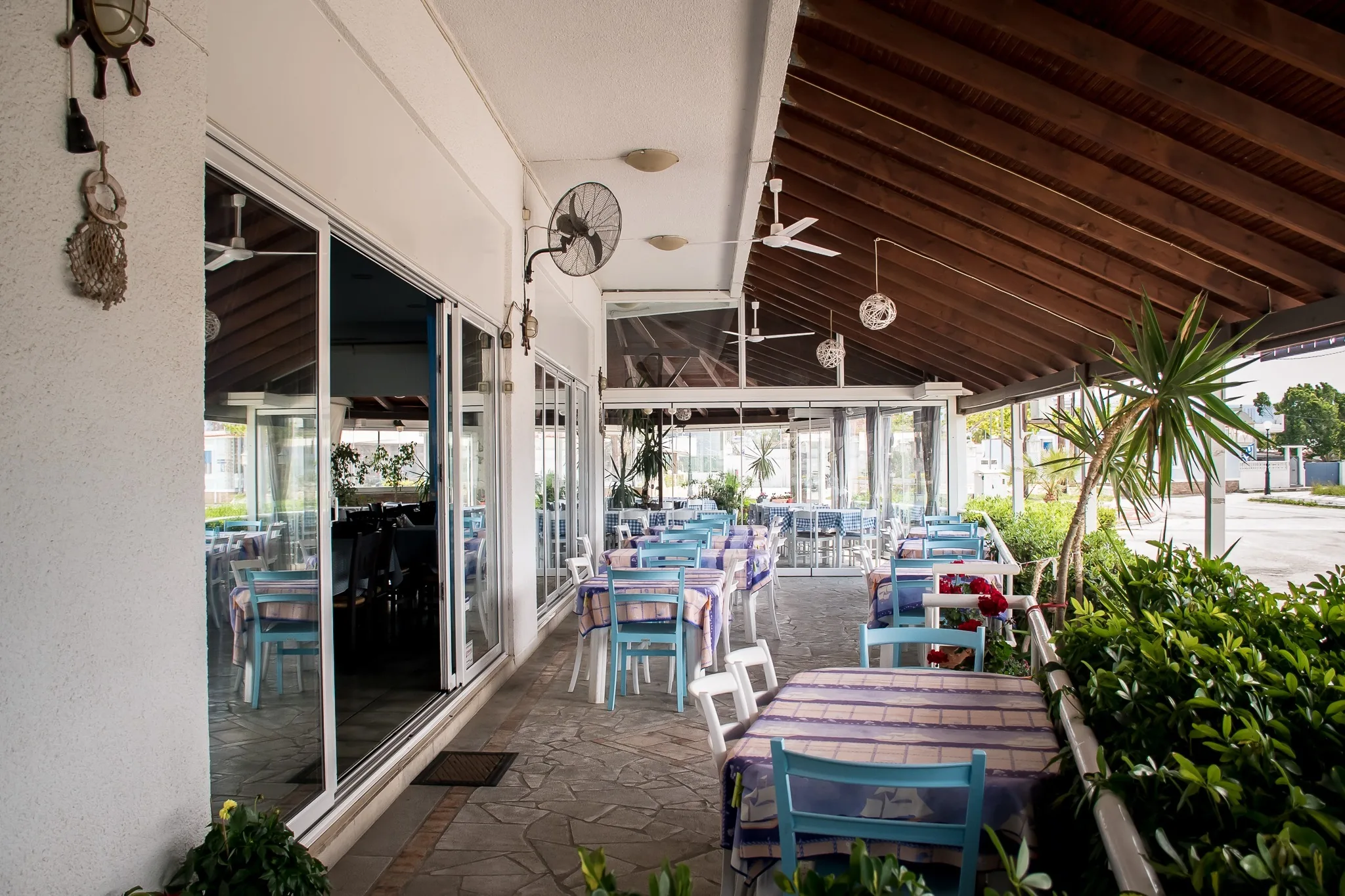 The tables along the covered veranda