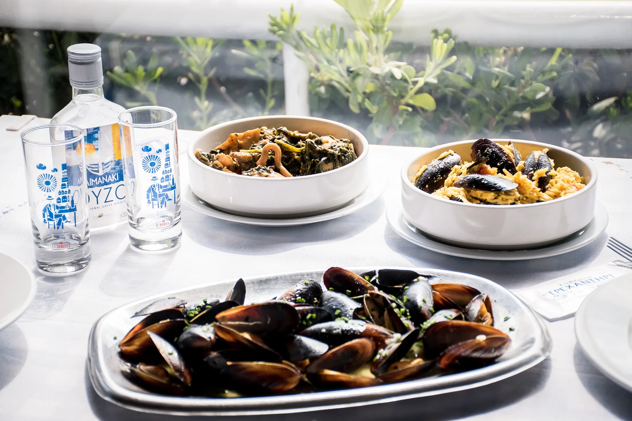 Steamed mussels, ouzo and meze