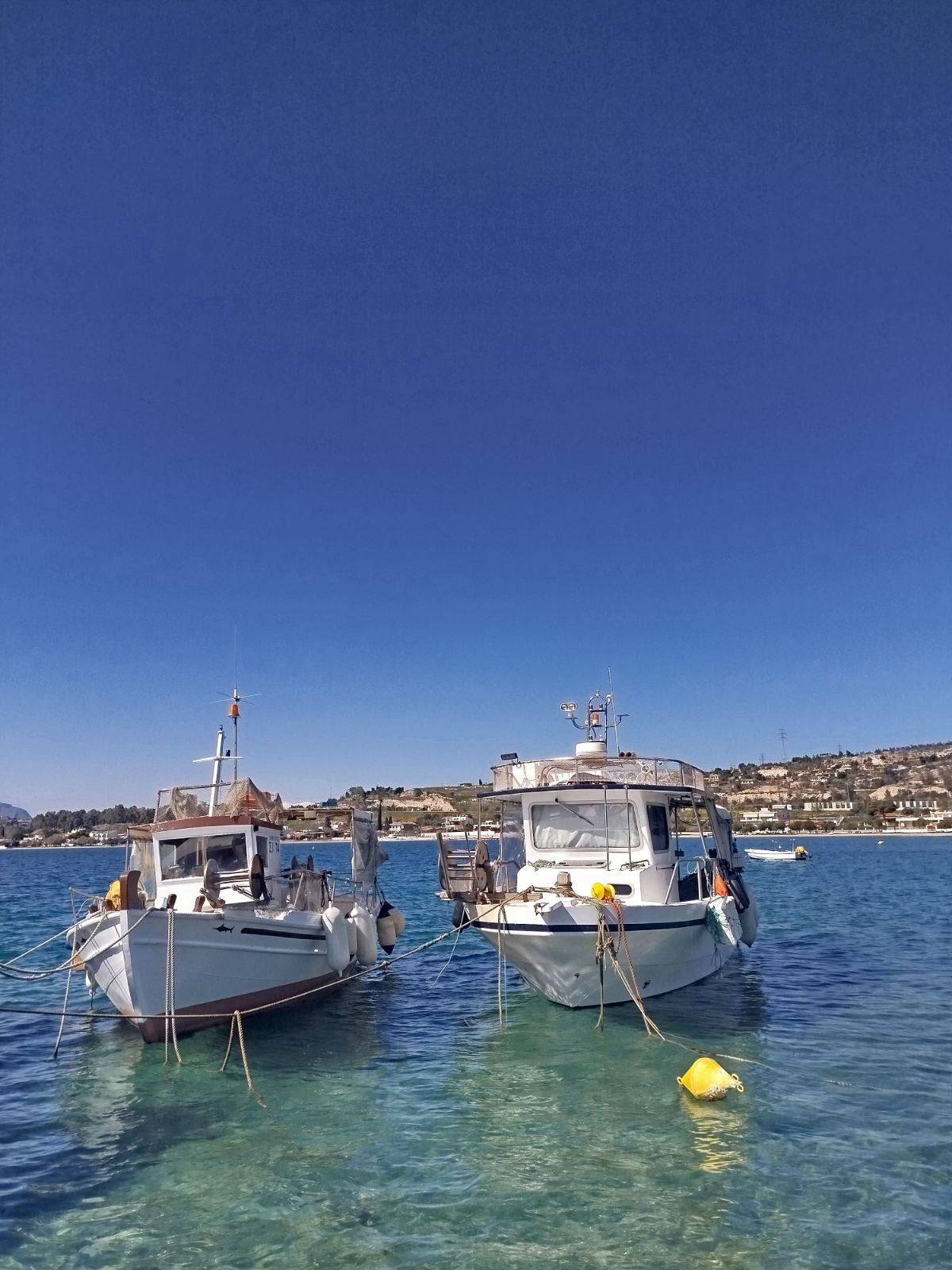 Our two boats, moored in the bay